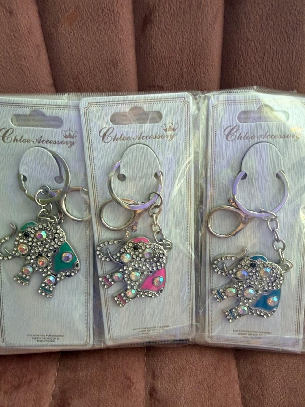 Set of 12 Sparkling Elephant Keychains. Set in gold and silver. Various colors